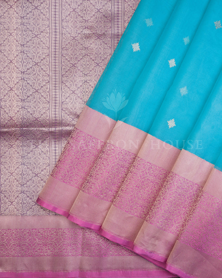 Turquoise Blue Kora Banarasi Saree with Silver Buttas & Mauve Floral Brocade Border – Handwoven Elegance