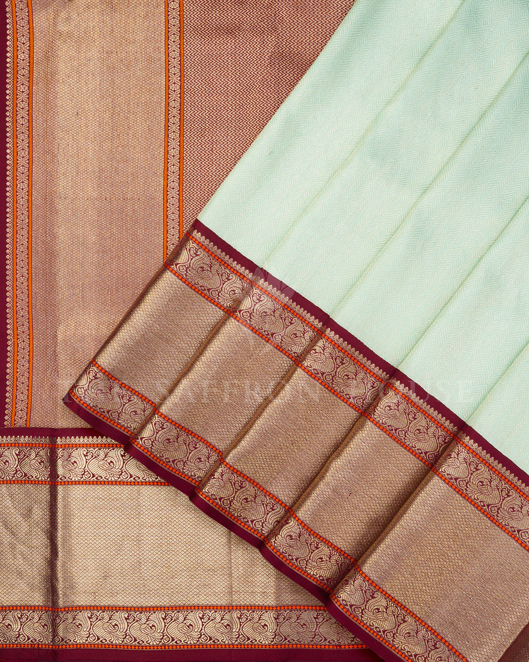 Mint Green Korvai Kanchivaram Silk Saree with Diagonal Zari Texture & Maroon Peacock Border