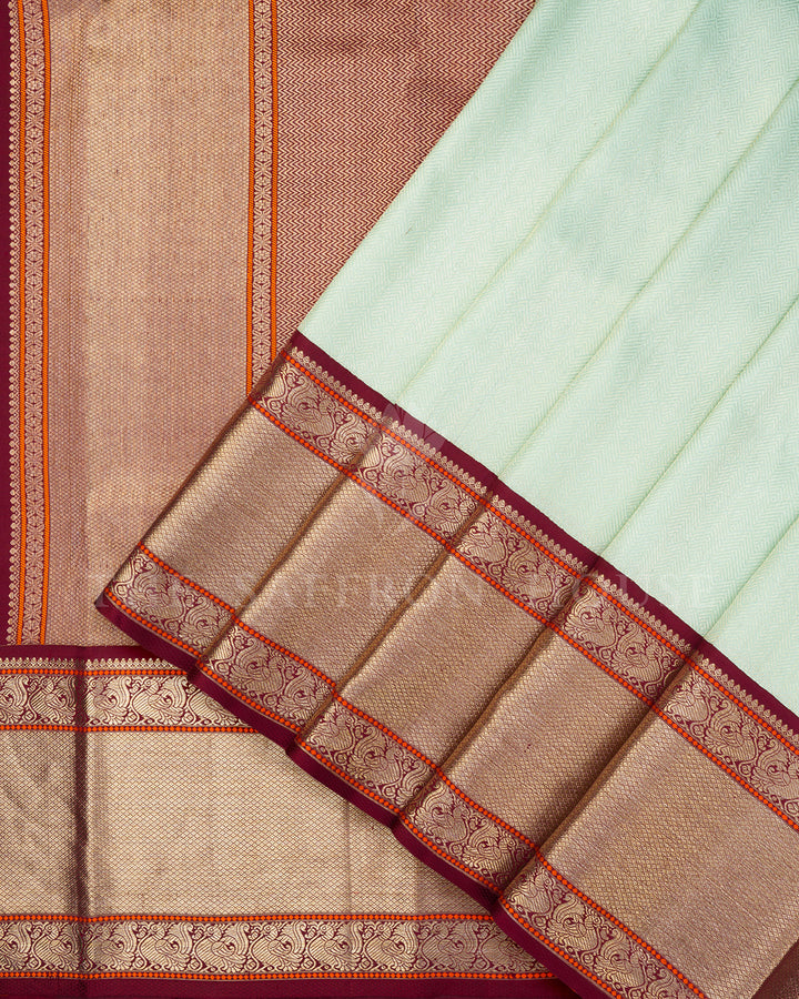 Mint Green Korvai Kanchivaram Silk Saree with Diagonal Zari Texture & Maroon Peacock Border