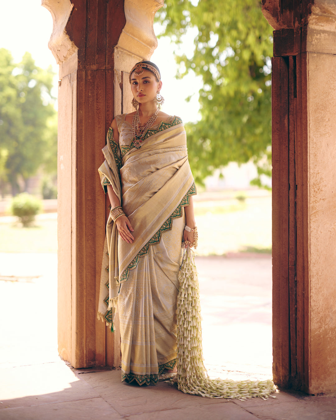 Silver Pure Kanjivaram Silk Saree with Emerald Green Zardozi & Mirror Work Border