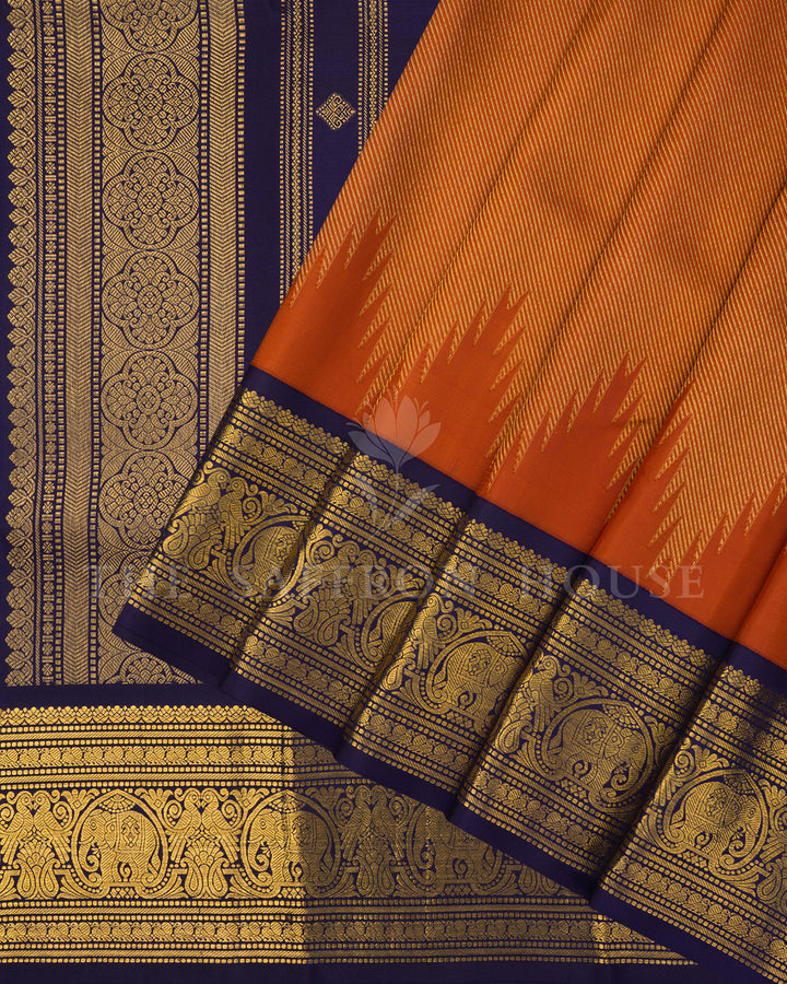 Rust Orange Kanchivaram Silk Saree with Navy Zari Elephant Border