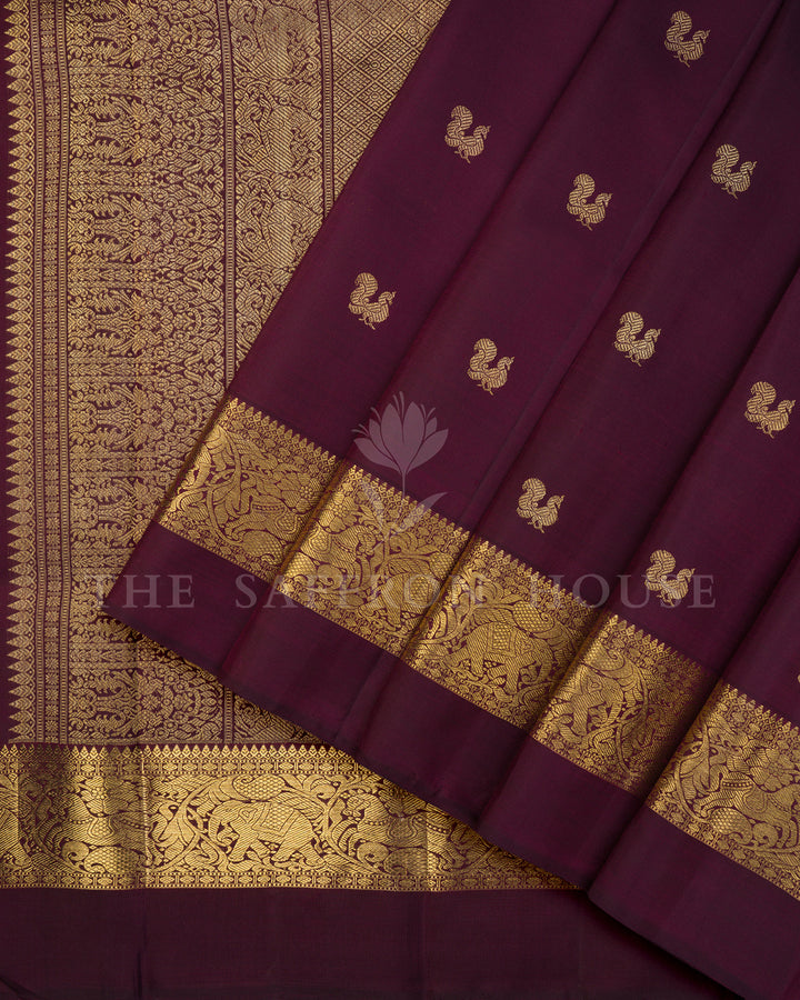 Wine Maroon Kanchivaram Silk Saree with Scattered Zari Peacock Butis & Elephant Shikargah Border