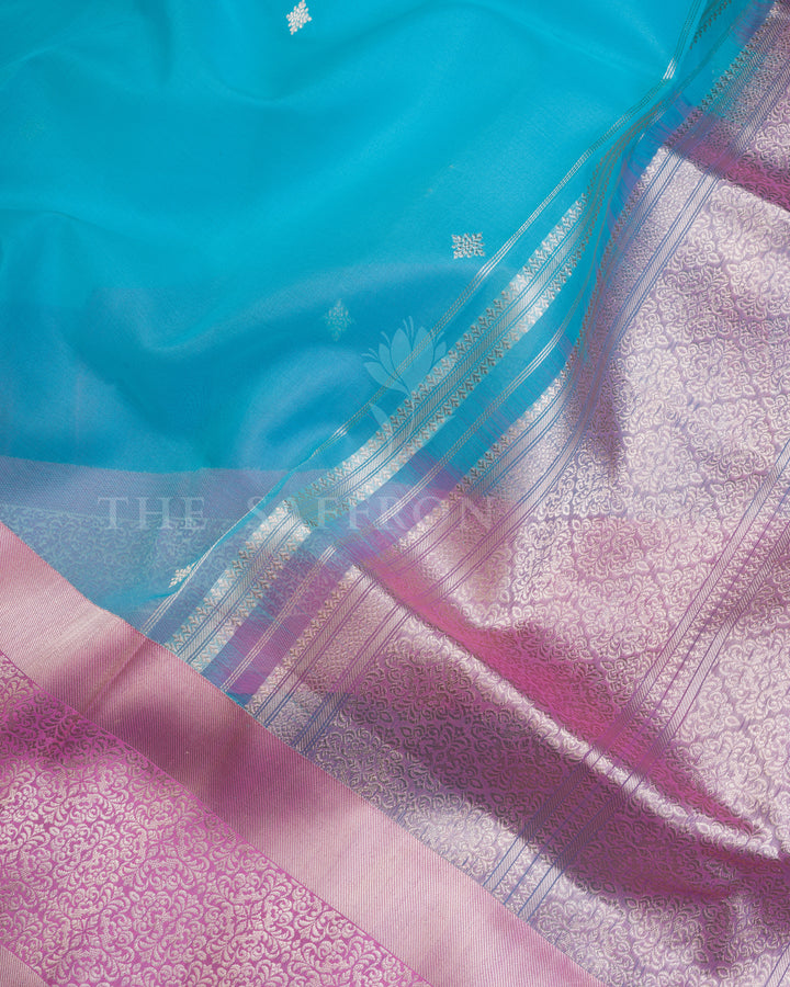 Turquoise Blue Kora Banarasi Saree with Silver Buttas & Mauve Floral Brocade Border – Handwoven Elegance