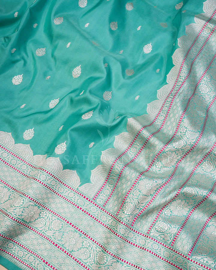 Turquoise Banarasi Silk Saree with Scattered Silver Zari Buti & Scalloped Floral Border