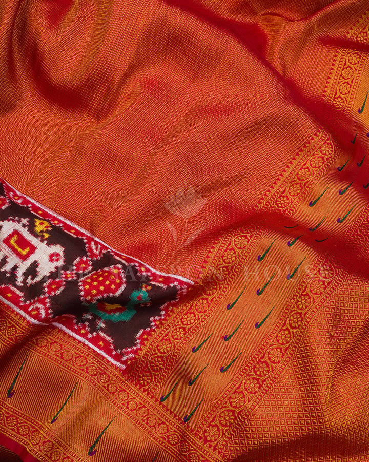 Rust Red Kanchivaram Silk Saree with Ikat Elephant-Peacock Panel & Peacock Feather Border