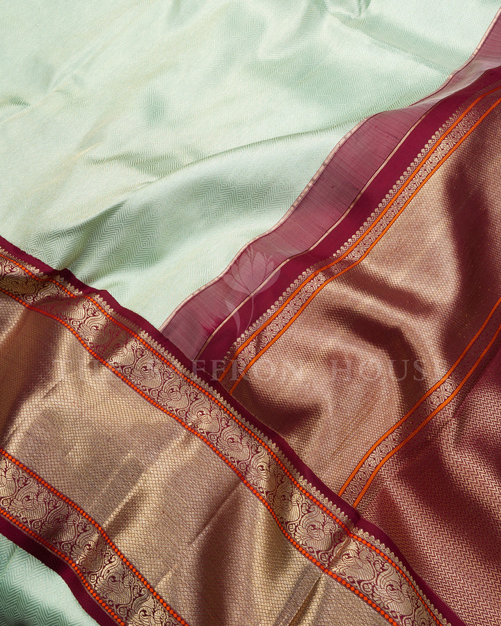 Mint Green Korvai Kanchivaram Silk Saree with Diagonal Zari Texture & Maroon Peacock Border