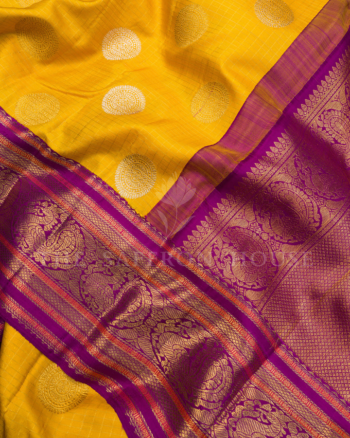 Yellow Kanchivaram Silk Saree with Silver Medallion Buti & Magenta Peacock Border