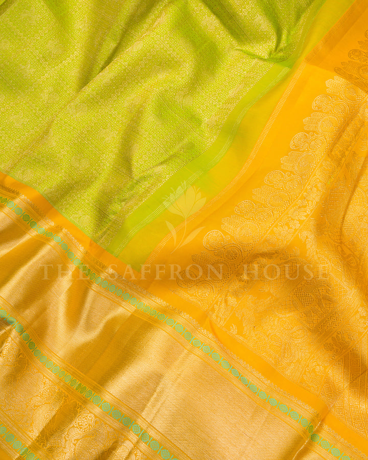 Parrot Green Kanchivaram Silk Saree with Zari Diamond Jaal & Golden Yellow Peacock Border