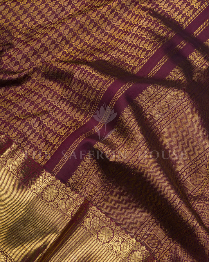 Burgundy Kanchivaram Silk Saree with Gold Leaf Weave & Peacock Border