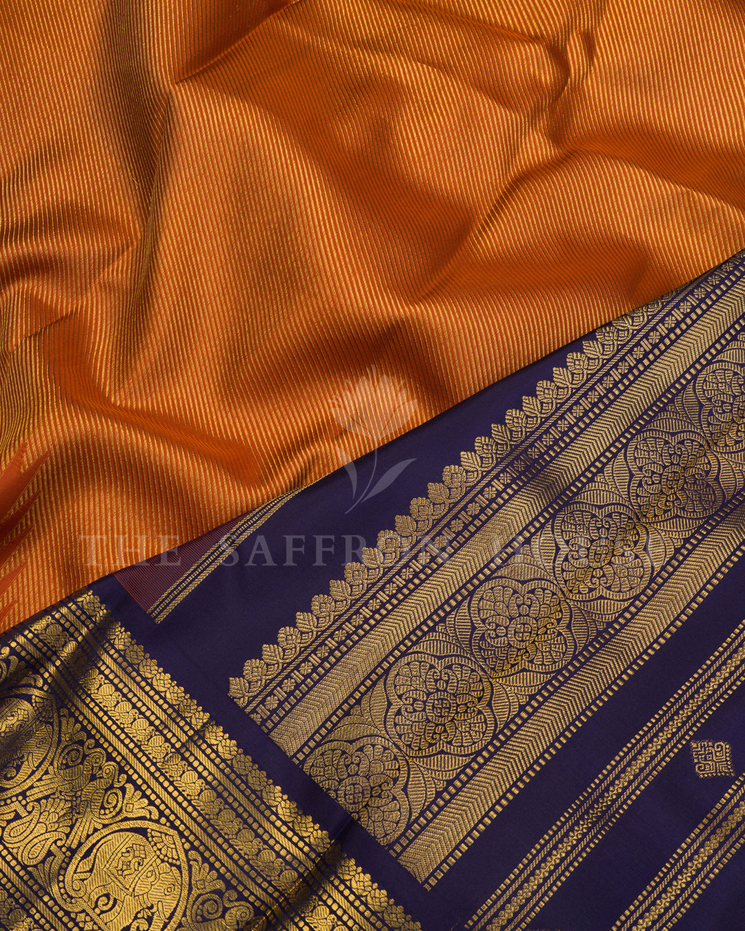 Rust Orange Kanchivaram Silk Saree with Navy Zari Elephant Border
