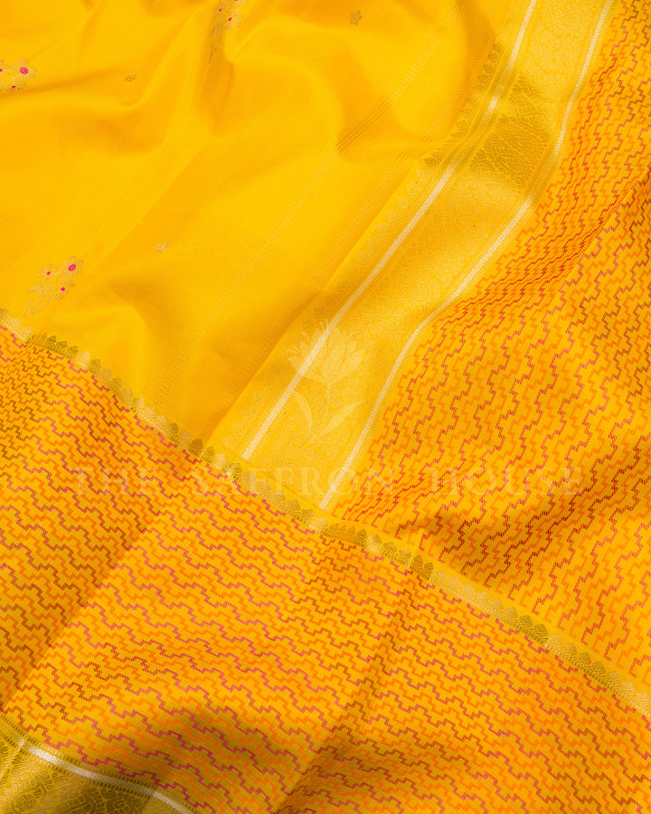 Yellow Kanchivaram Silk Saree with Scattered Zari Butis & Pink-Orange Chevron Border