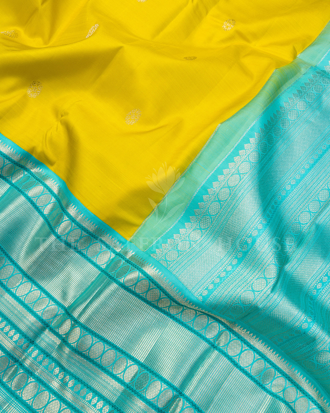 Yellow Kanchivaram Silk Saree with Silver Zari Butis & Turquoise Contrast Border
