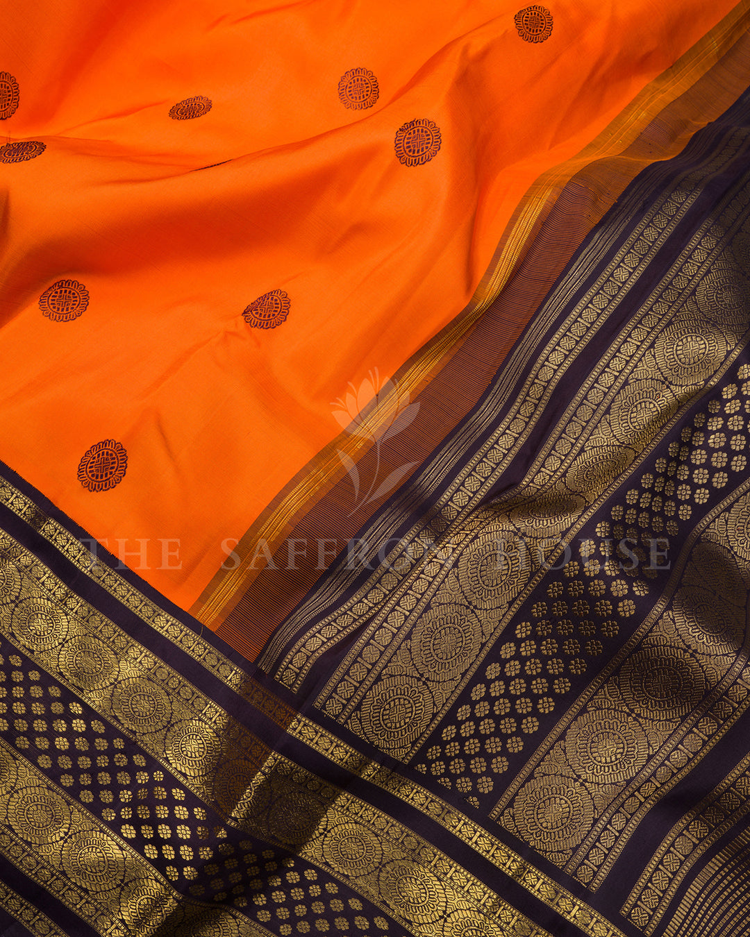 Orange Kanchivaram Silk Saree with Scattered Zari Butis & Deep Purple Medallion Border