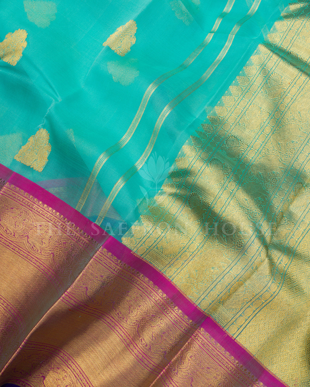 Turquoise Kora Kanchivaram Silk Saree with Gold Zari Butis & Magenta-Blue Contrast Border