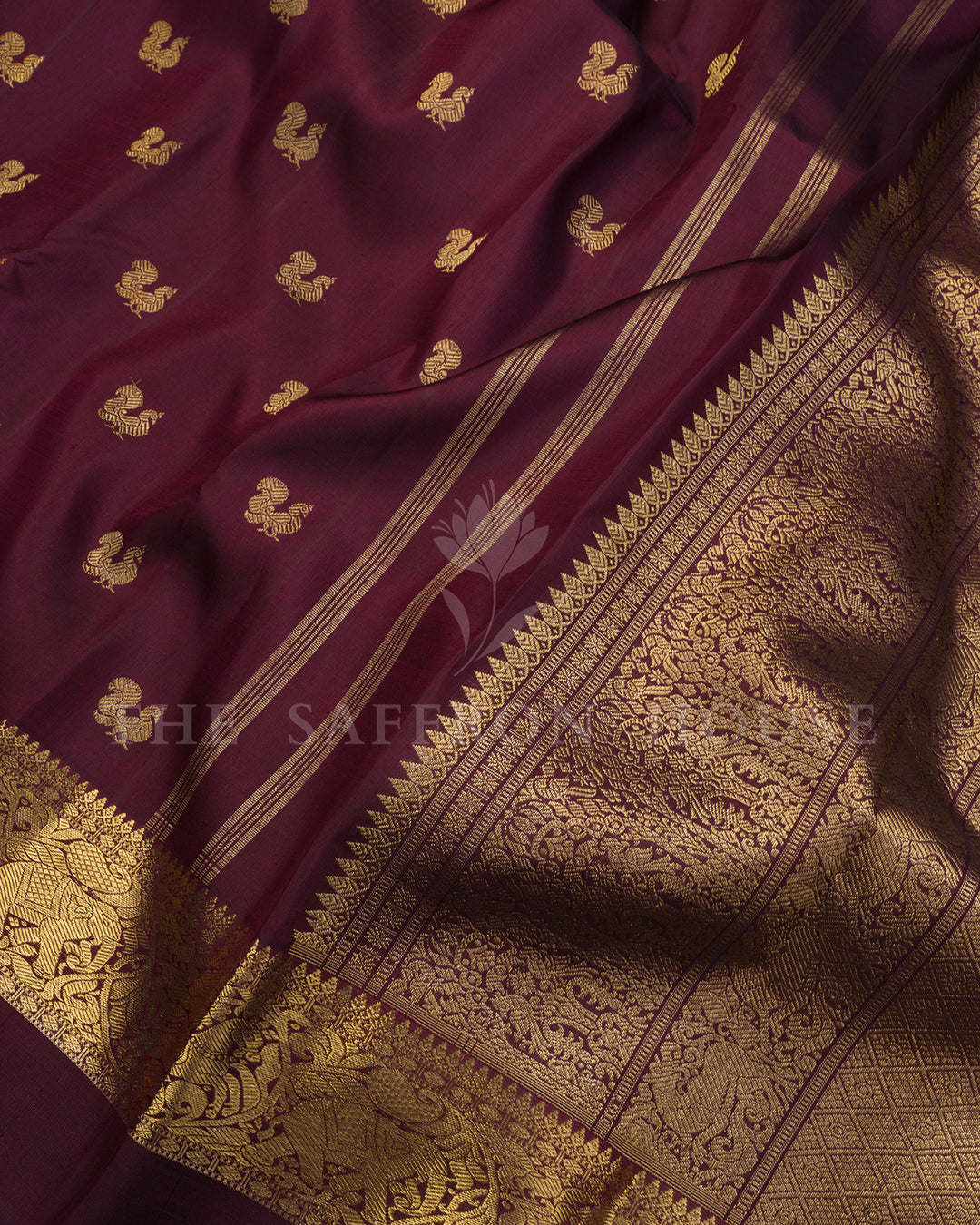 Wine Maroon Kanchivaram Silk Saree with Scattered Zari Peacock Butis & Elephant Shikargah Border