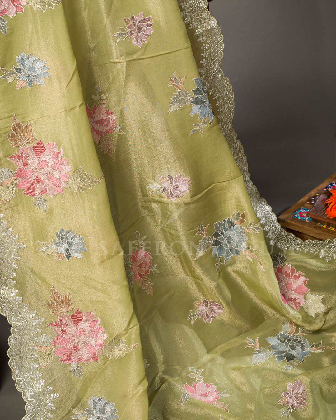 Green Tissue Organza Saree with Multicolor Floral Motifs & Scalloped Lace Border