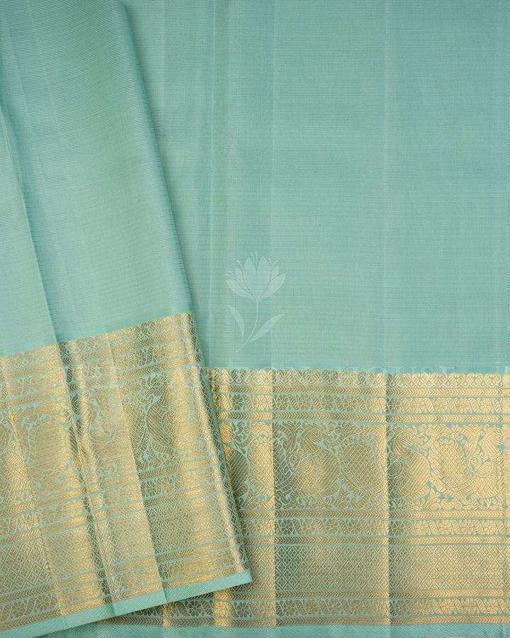 Sea Green Kanchivaram Silk Saree with Diagonal Gold Zari Weave & Peacock Motif Border