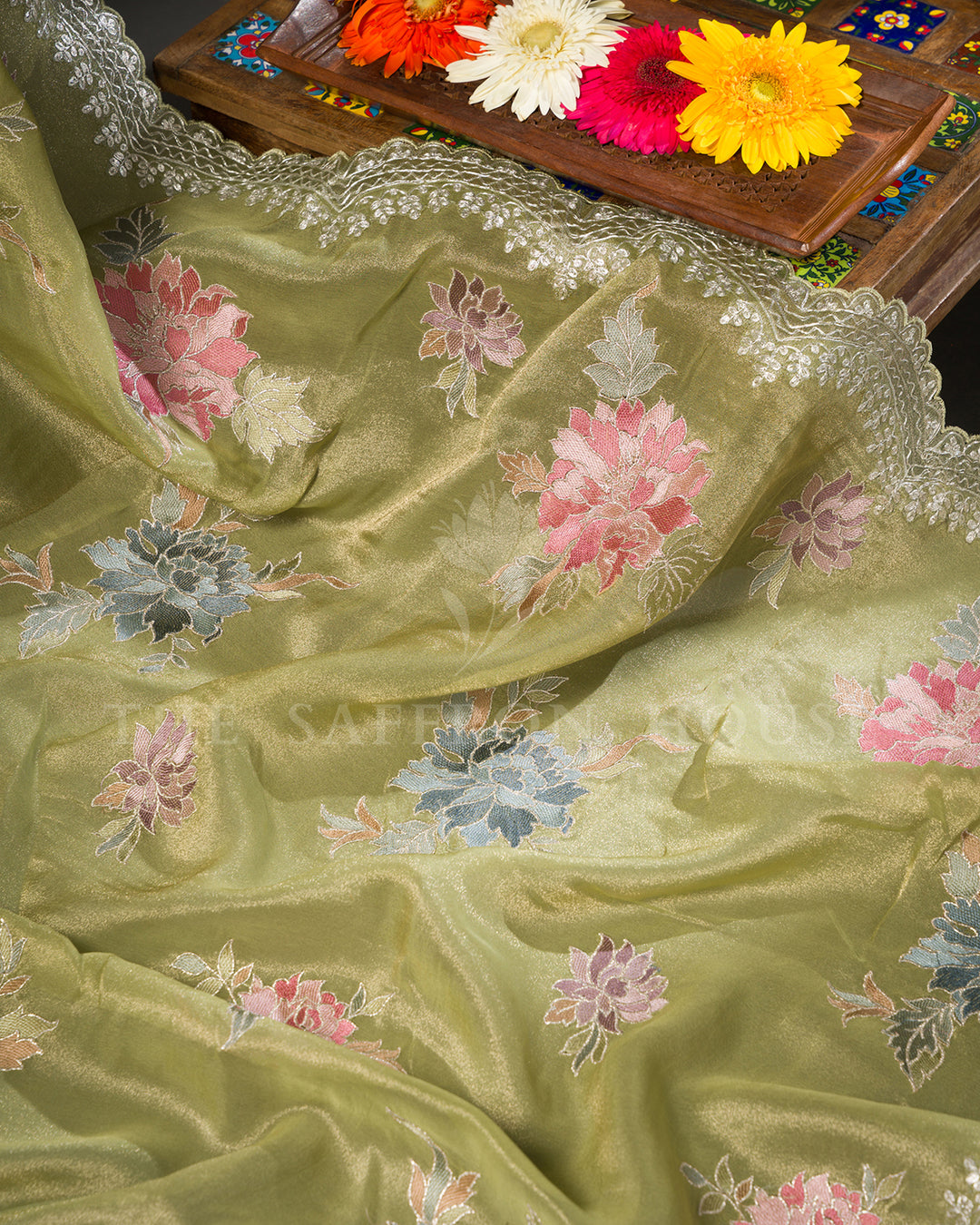 Green Tissue Organza Saree with Multicolor Floral Motifs & Scalloped Lace Border