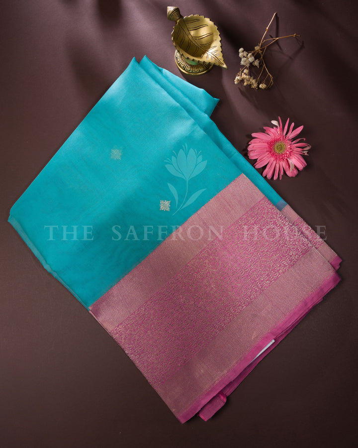 Turquoise Blue Kora Banarasi Saree with Silver Buttas & Mauve Floral Brocade Border – Handwoven Elegance