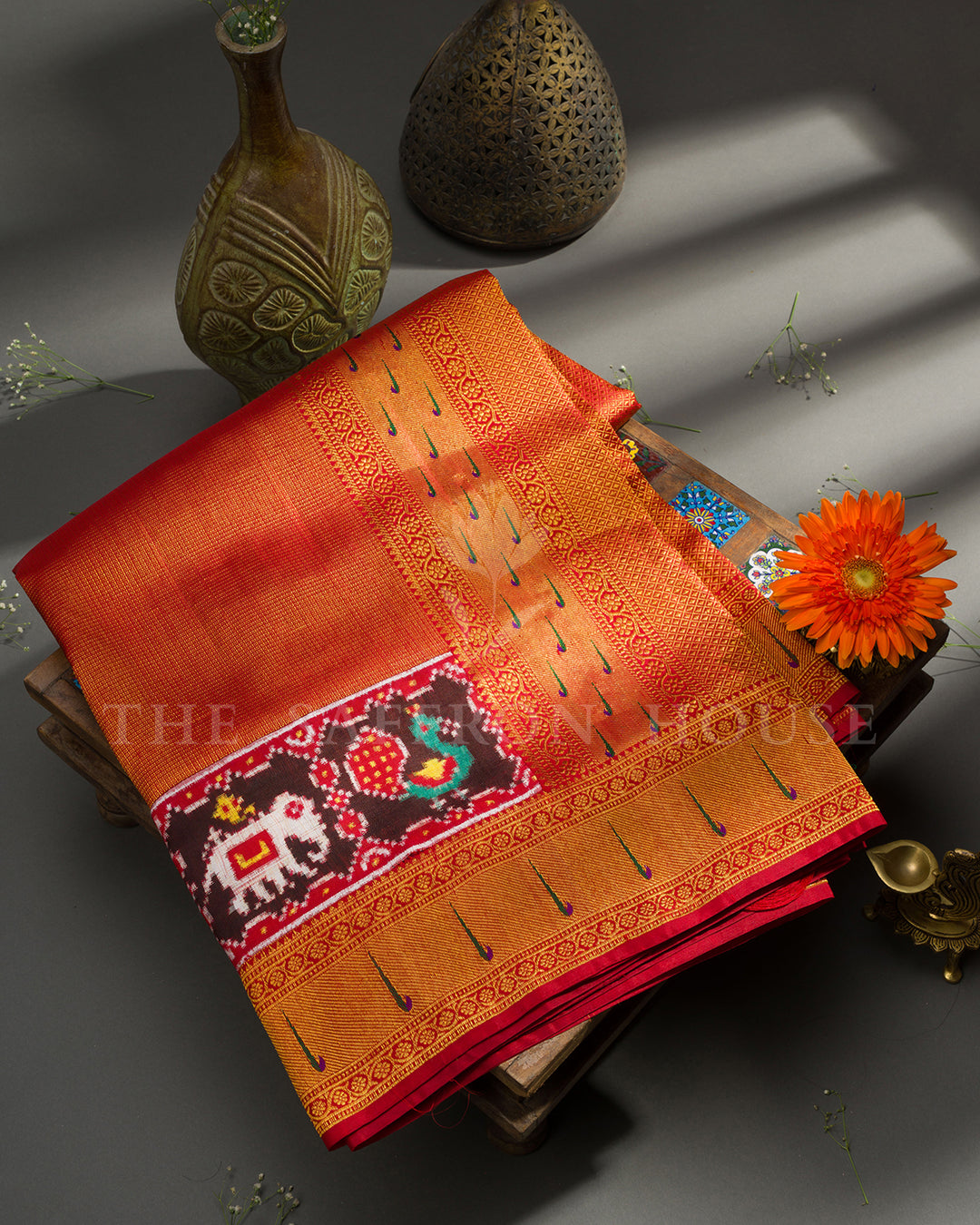 Rust Red Kanchivaram Silk Saree with Ikat Elephant-Peacock Panel & Peacock Feather Border