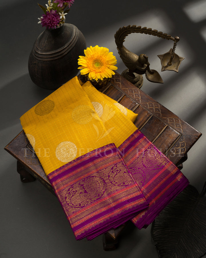 Yellow Kanchivaram Silk Saree with Silver Medallion Buti & Magenta Peacock Border