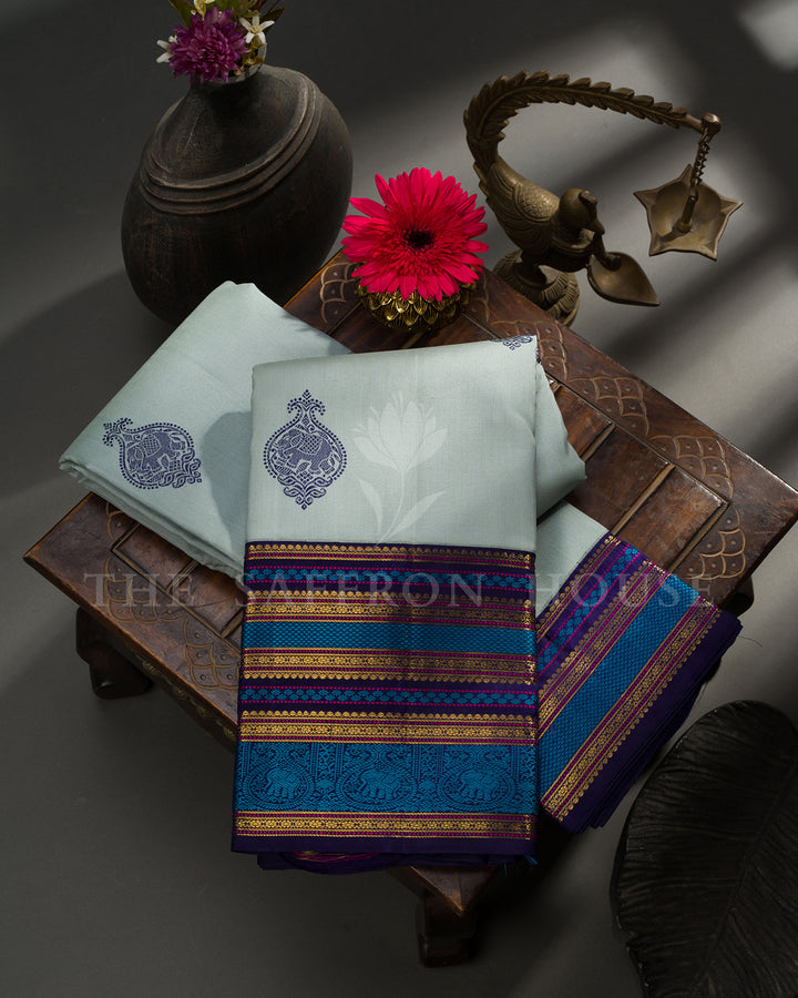 Powder Blue Kanchivaram Silk Saree with Navy Elephant Buttis, Multicolor Border