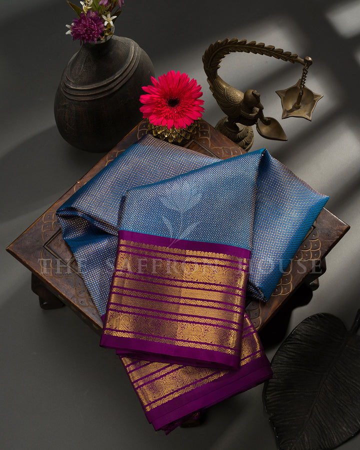 Peacock Blue Kanchivaram Silk Saree with Purple Zari Striped Border