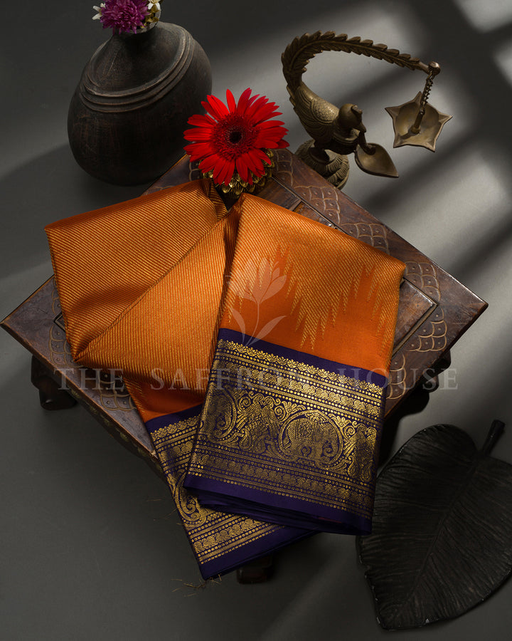 Rust Orange Kanchivaram Silk Saree with Navy Zari Elephant Border