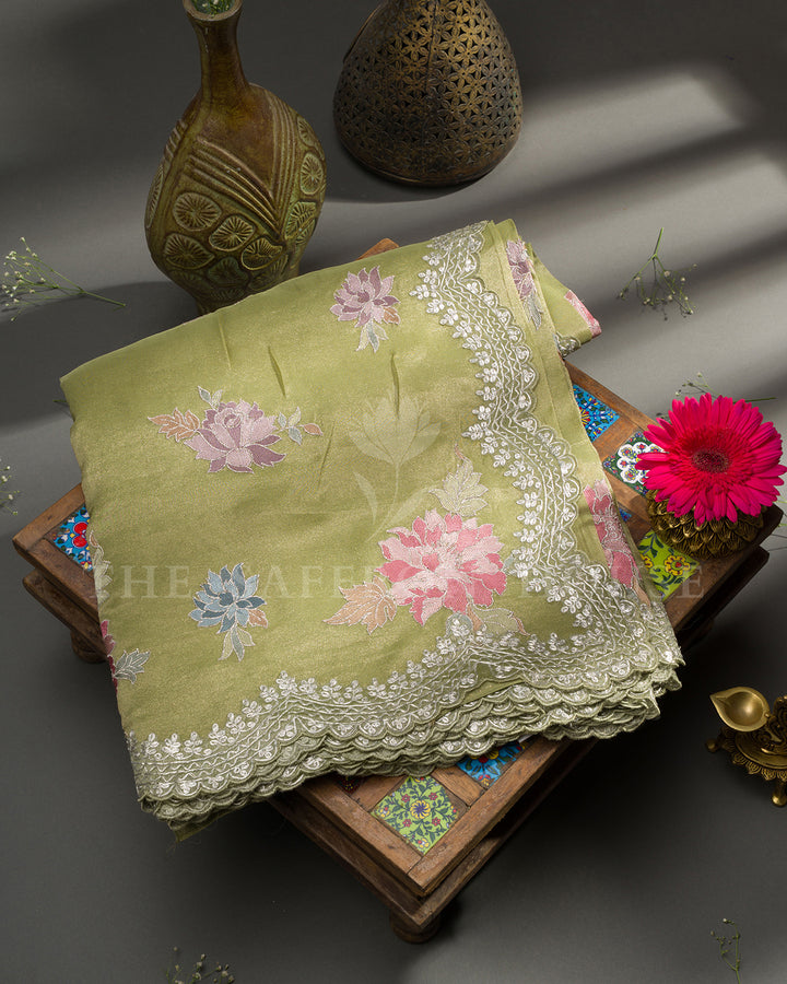 Green Tissue Organza Saree with Multicolor Floral Motifs & Scalloped Lace Border