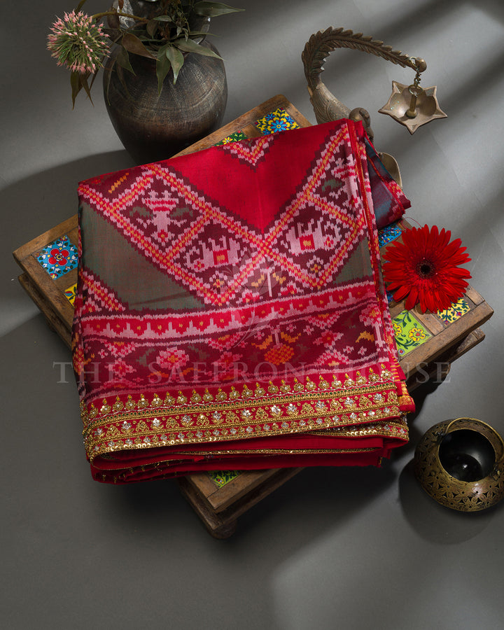 Red Hand Embroidered Border Ikat Silk Saree