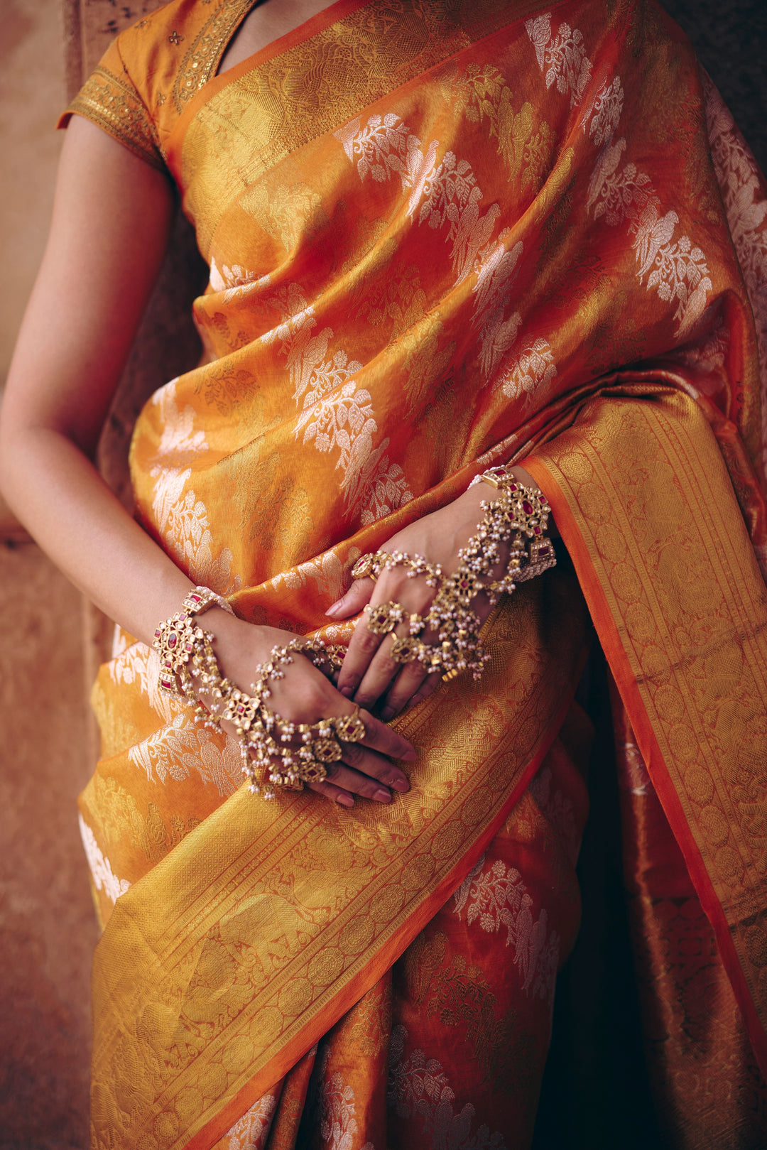 Orange Pure Kanjivaram Silk Saree with Silver Zari Parrot Buttas & Gold Zari Border