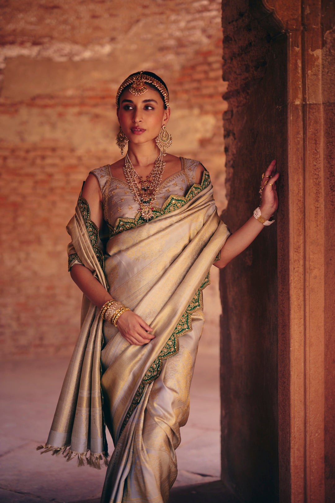 Silver Pure Kanjivaram Silk Saree with Emerald Green Zardozi & Mirror Work Border