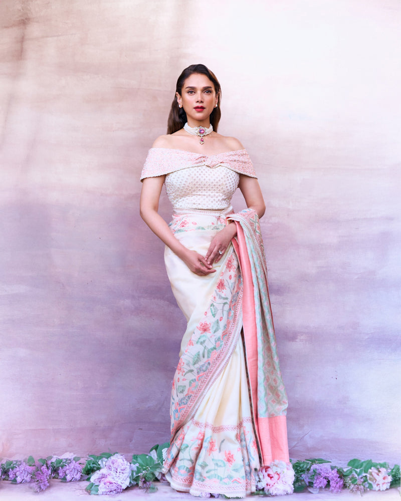 Aditi Rao Hydari in a pale saree with a pink and green patterned pallu