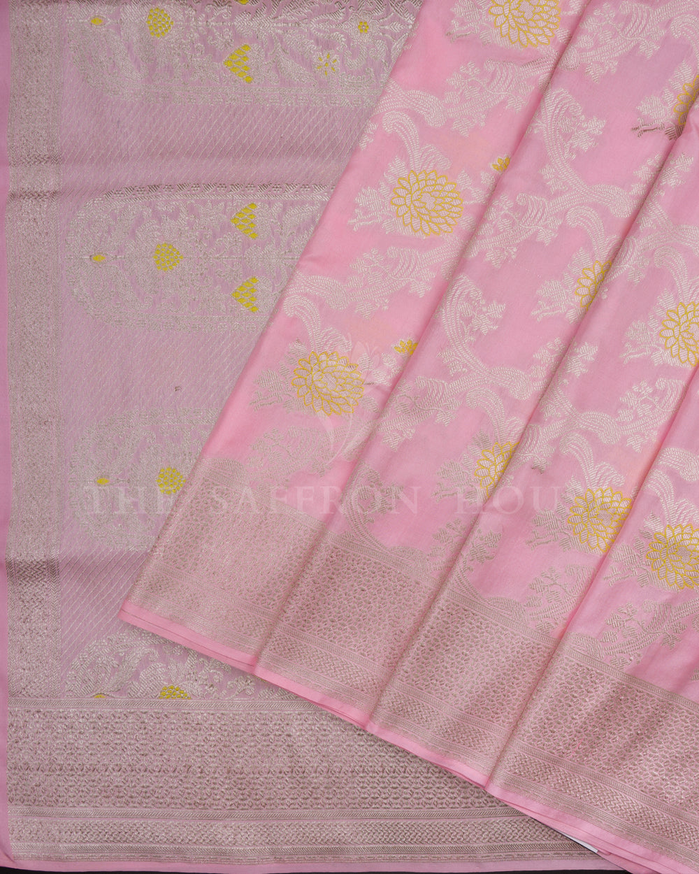 Baby pink handwoven Banarasi silk saree featuring intricate gold zari work, crafted by The Saffron House.