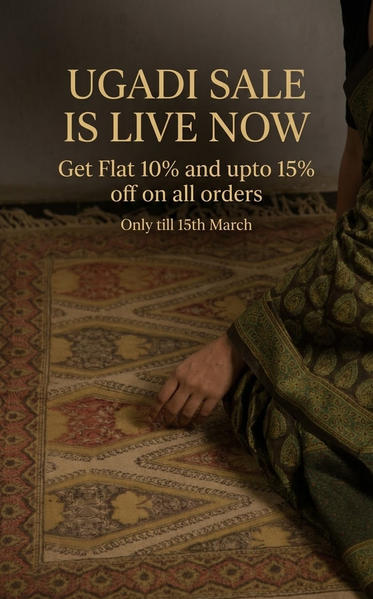 Promotional text overlay for Ugadi sale on a background with a patterned fabric.